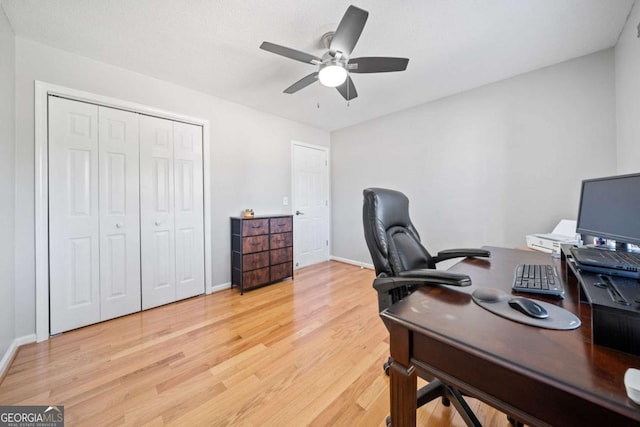 office space with hardwood / wood-style floors and ceiling fan