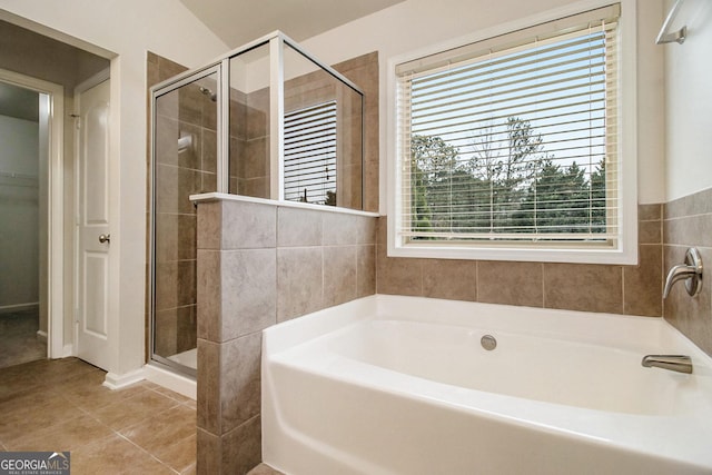 bathroom with tile patterned floors, plenty of natural light, and independent shower and bath