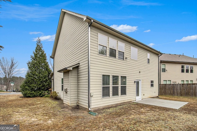 back of property with a patio area