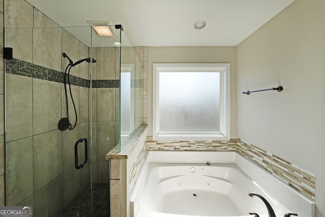 bathroom with shower with separate bathtub