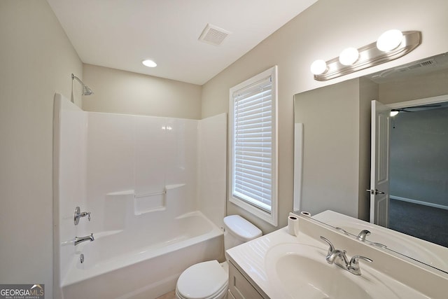 full bathroom featuring shower / bath combination, toilet, and vanity