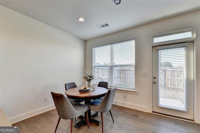 dining space featuring hardwood / wood-style floors and a wealth of natural light