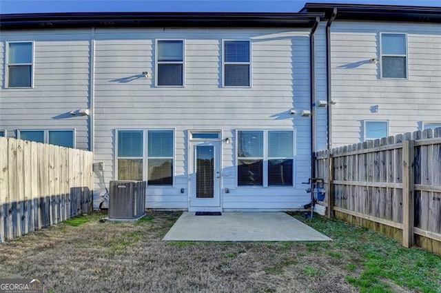 back of house featuring cooling unit and a patio