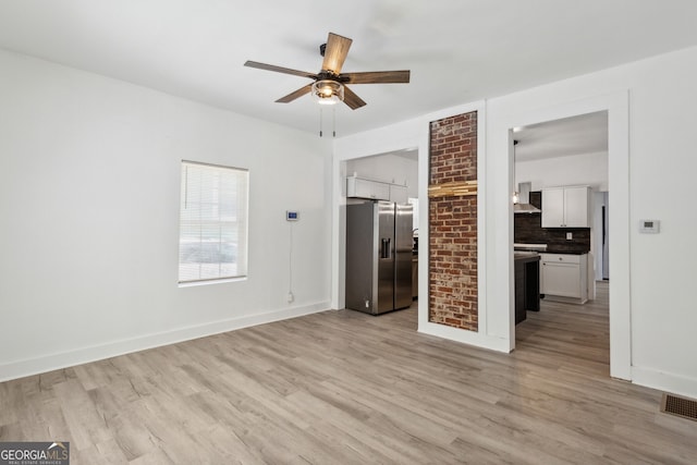 interior space featuring ceiling fan and light hardwood / wood-style flooring