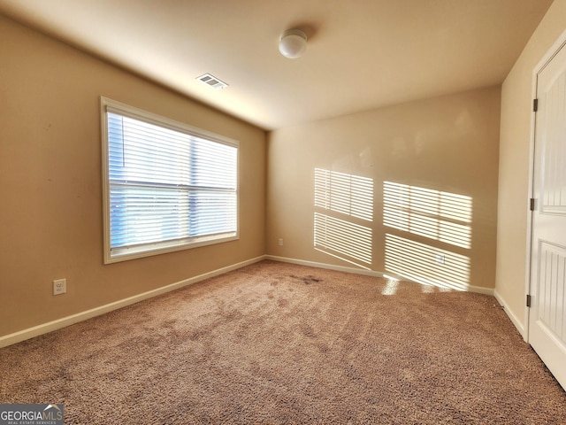 view of carpeted spare room