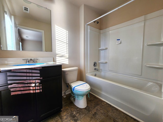 full bathroom with shower / tub combination, vanity, and toilet