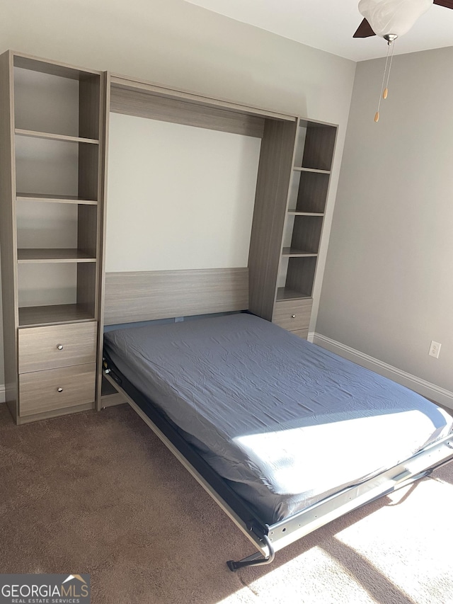 unfurnished bedroom featuring carpet flooring and ceiling fan