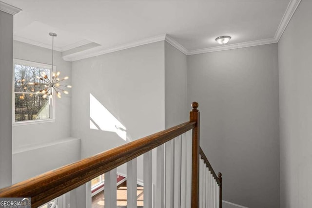 interior space featuring crown molding and a chandelier