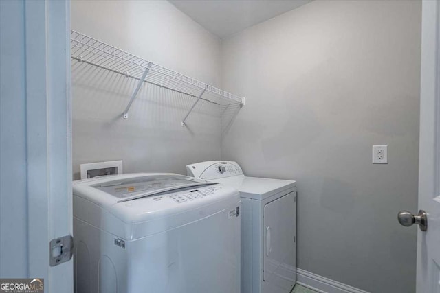 washroom with separate washer and dryer