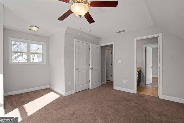 unfurnished bedroom with carpet flooring, a closet, and ceiling fan