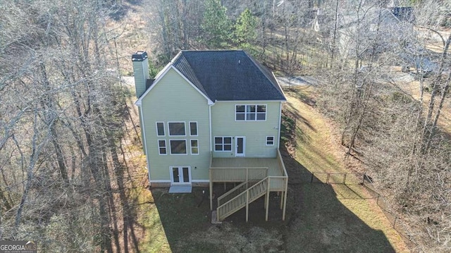 rear view of property featuring french doors and a deck