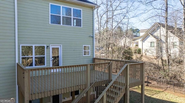 rear view of property with a wooden deck