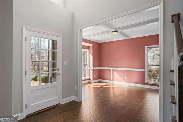 entryway featuring dark wood-type flooring, beamed ceiling, a healthy amount of sunlight, and coffered ceiling