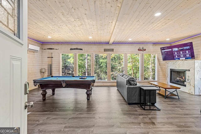 game room with a wall mounted air conditioner, wood ceiling, hardwood / wood-style flooring, a fireplace, and pool table