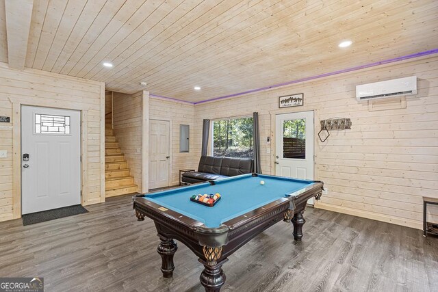 recreation room with a wall mounted AC, wood walls, wood ceiling, and pool table