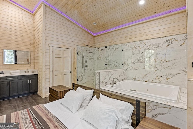 bedroom with wood ceiling, wooden walls, and vaulted ceiling