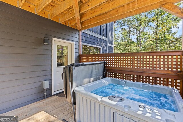 deck with a hot tub