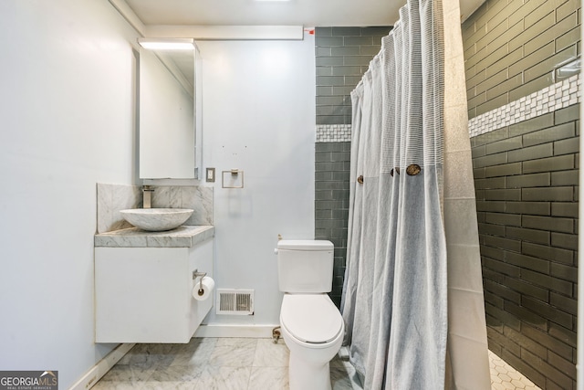 bathroom featuring toilet, vanity, and a shower with curtain