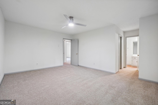 empty room with light carpet and ceiling fan