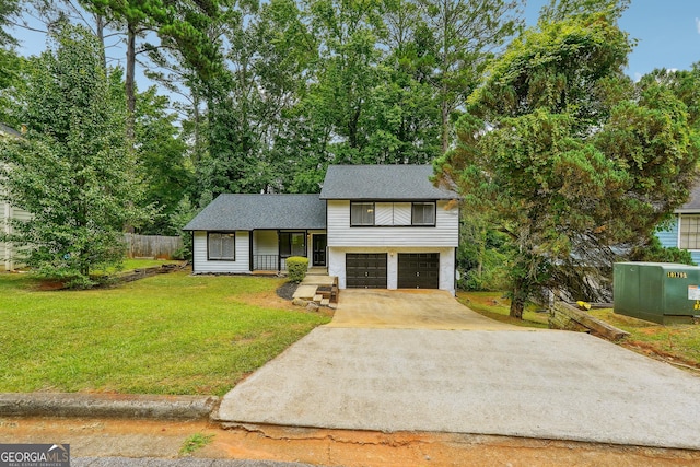 split level home featuring a front yard and a garage