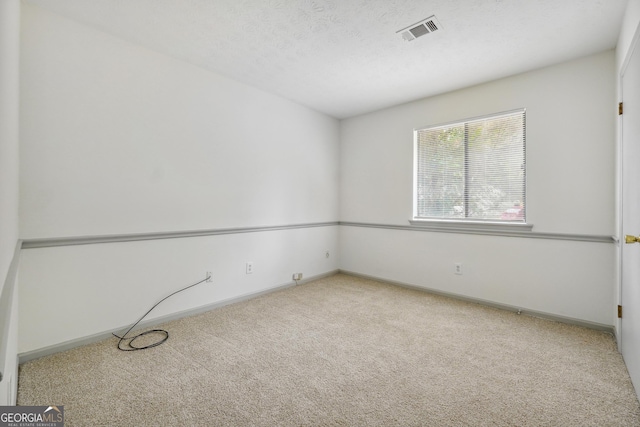 empty room featuring light colored carpet