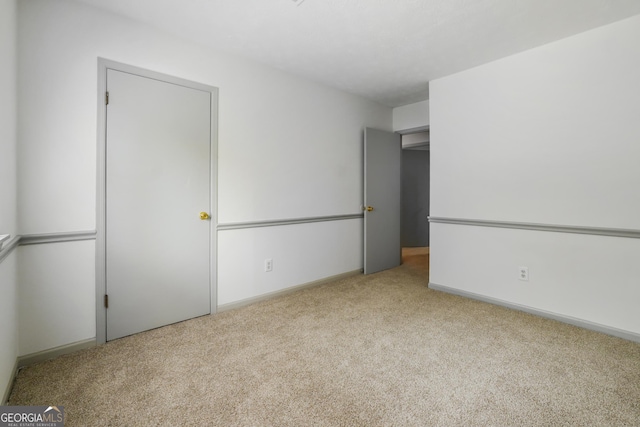 unfurnished bedroom with light carpet