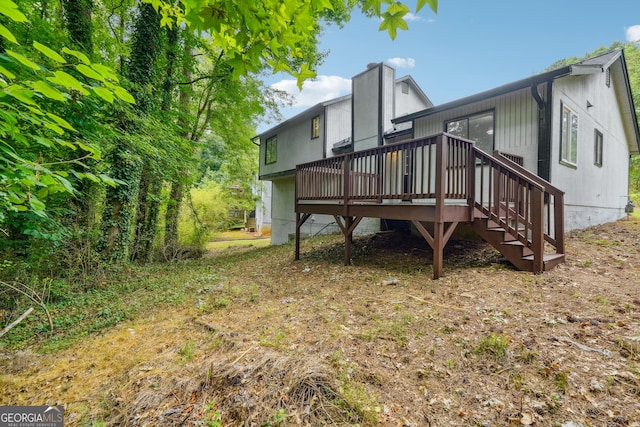 back of house featuring a deck