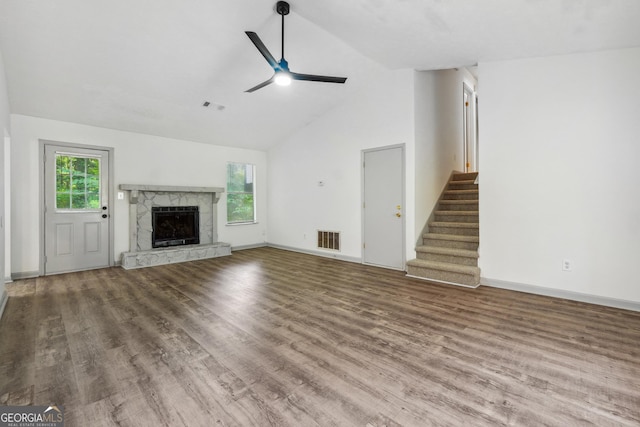 unfurnished living room featuring ceiling fan, high vaulted ceiling, and hardwood / wood-style flooring