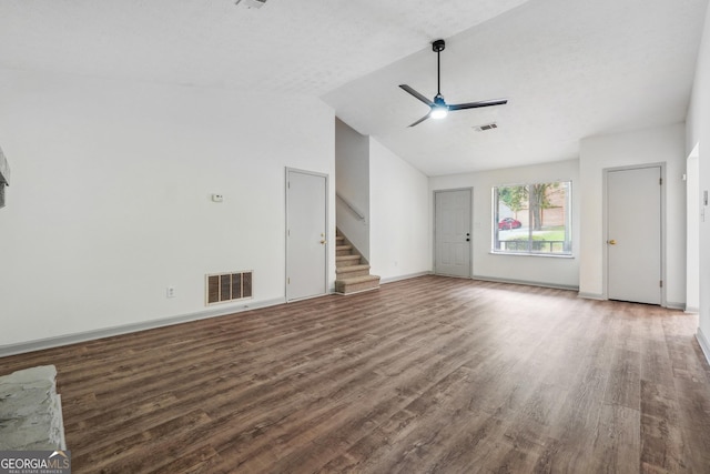 unfurnished living room featuring vaulted ceiling, ceiling fan, a textured ceiling, and hardwood / wood-style floors