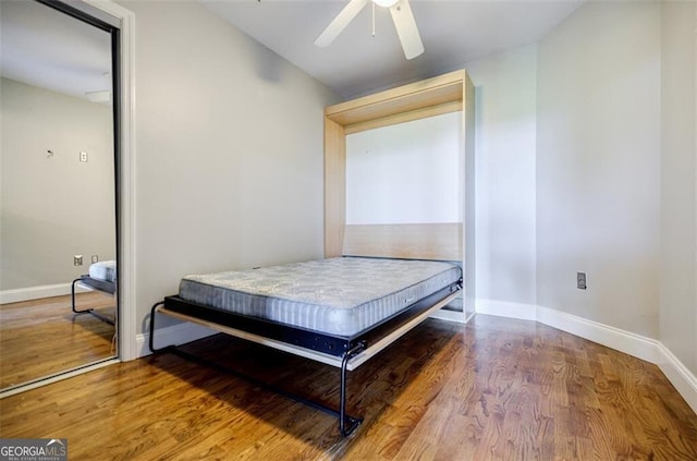 bedroom featuring ceiling fan and hardwood / wood-style floors