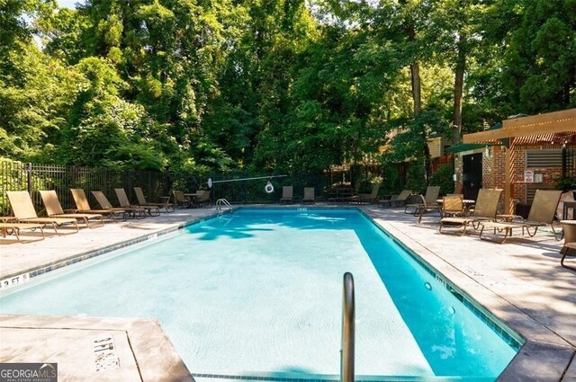 view of swimming pool with a patio