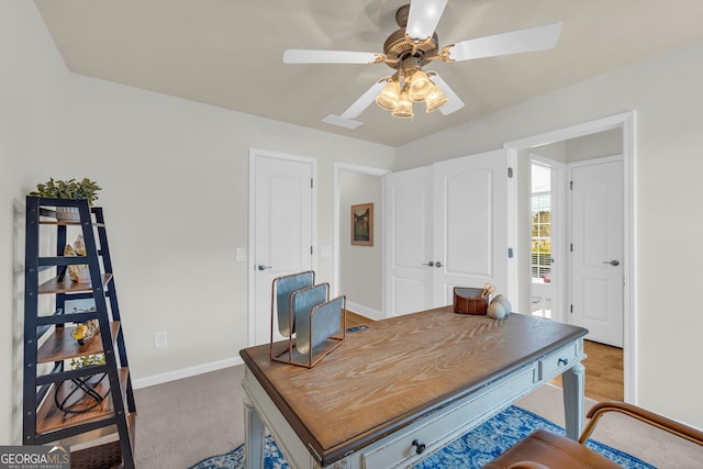 office with carpet flooring and ceiling fan