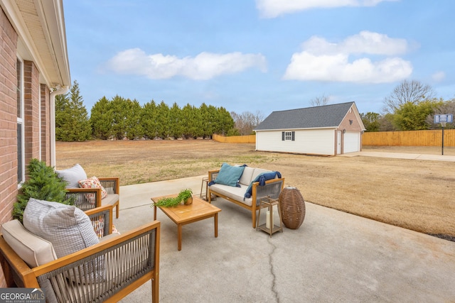 view of patio featuring an outdoor living space, a garage, and an outdoor structure