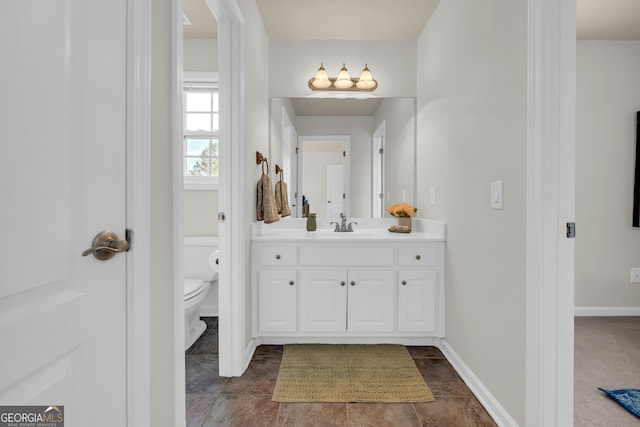 bathroom with vanity and toilet