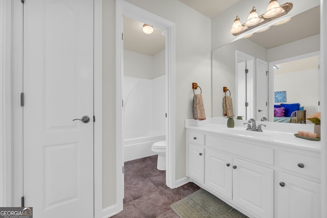 bathroom with tile patterned floors, vanity, and toilet