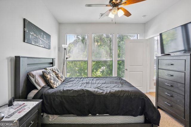 bedroom with light colored carpet and ceiling fan