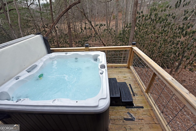 wooden terrace with a hot tub