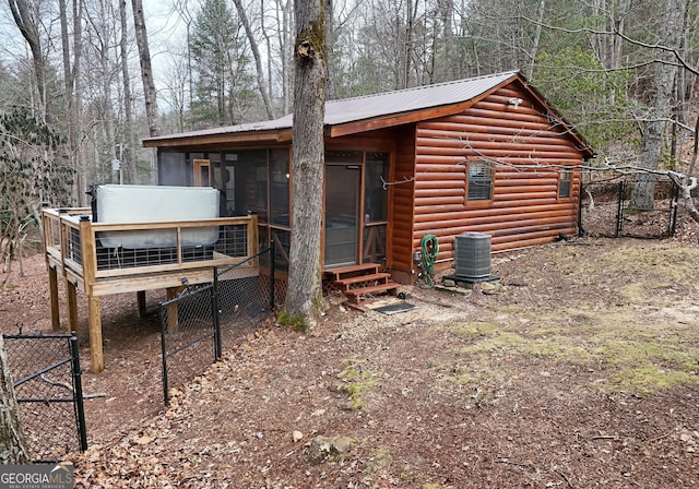 view of outdoor structure with central AC unit