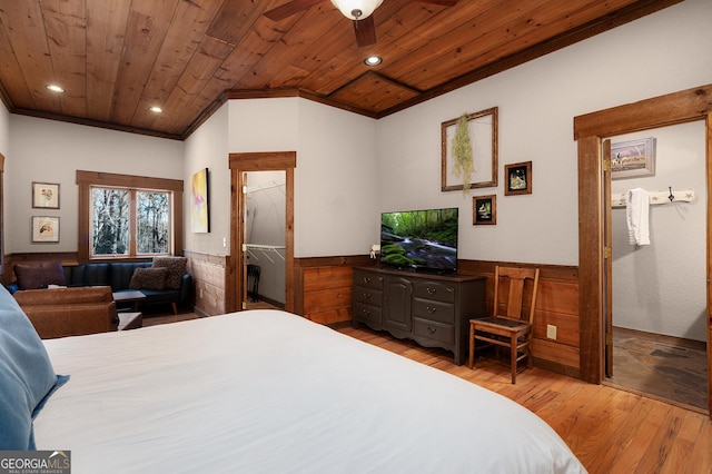 bedroom featuring ornamental molding, light hardwood / wood-style flooring, wooden ceiling, and wood walls