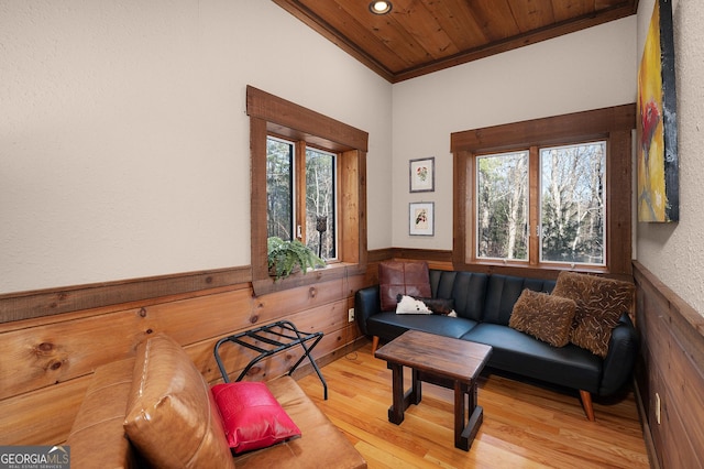 sitting room featuring wooden ceiling, crown molding, and light hardwood / wood-style flooring