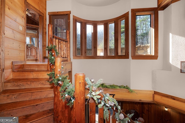 stairway with wooden walls