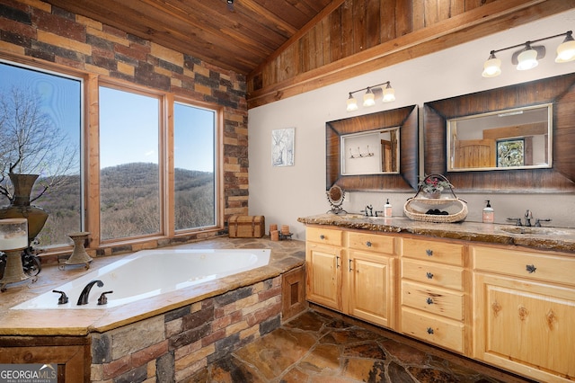 bathroom with wooden ceiling, vanity, a bath, and lofted ceiling