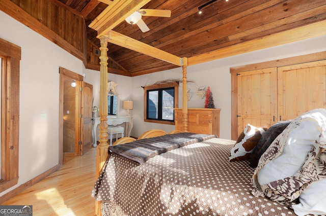 bedroom featuring lofted ceiling with beams, ceiling fan, wooden ceiling, and light hardwood / wood-style floors