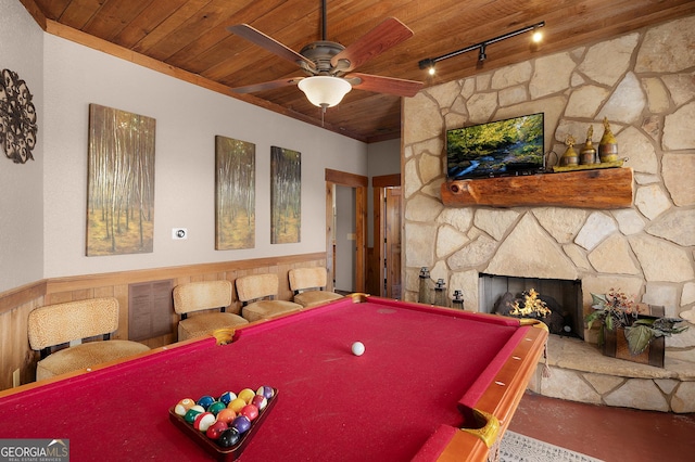 recreation room with ceiling fan, rail lighting, a fireplace, wood ceiling, and pool table