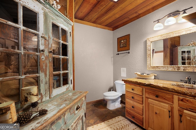 bathroom with vanity, wooden ceiling, and toilet