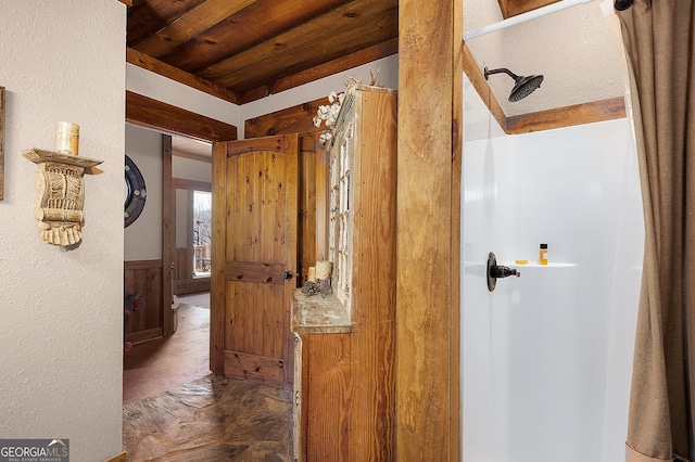 hallway featuring wooden walls and wood ceiling