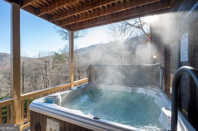 deck featuring a hot tub