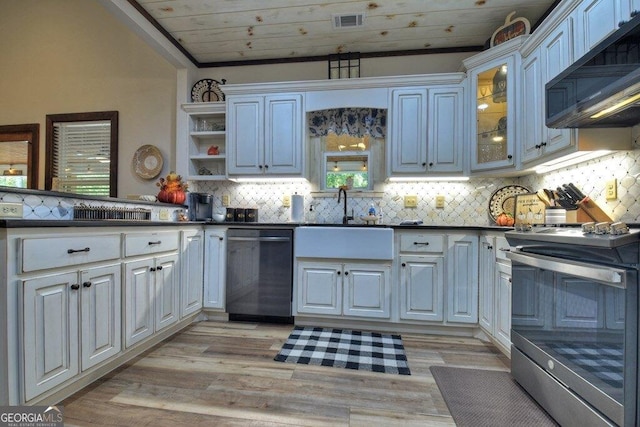 kitchen featuring white cabinets, stainless steel range with electric cooktop, sink, dishwasher, and lofted ceiling