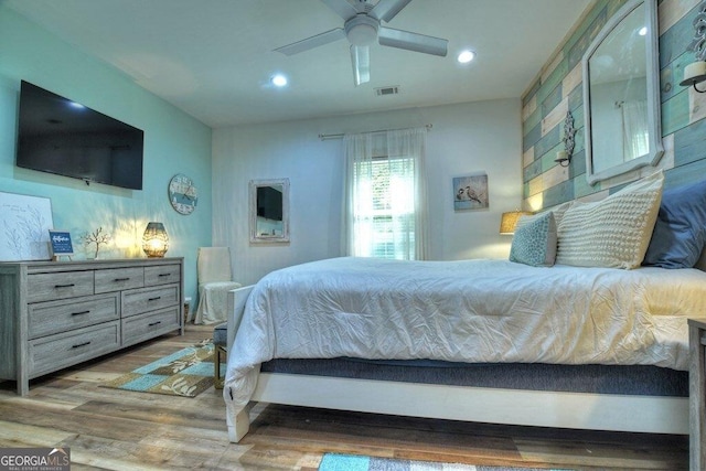 bedroom featuring wood-type flooring and ceiling fan