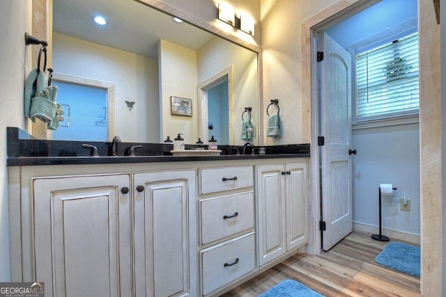 bathroom with wood-type flooring and vanity